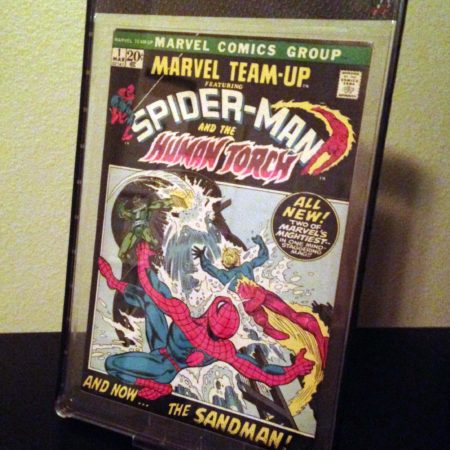 A framed comic book is displayed on the wall.